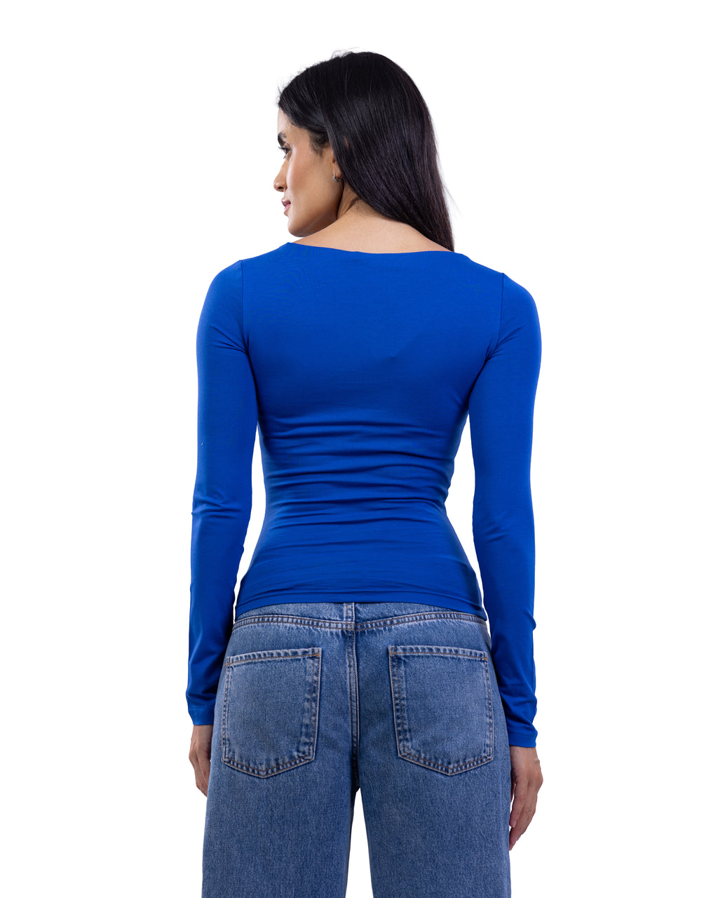 A woman shown from the back wearing a fitted royal blue long-sleeve top and blue jeans against a plain white background.