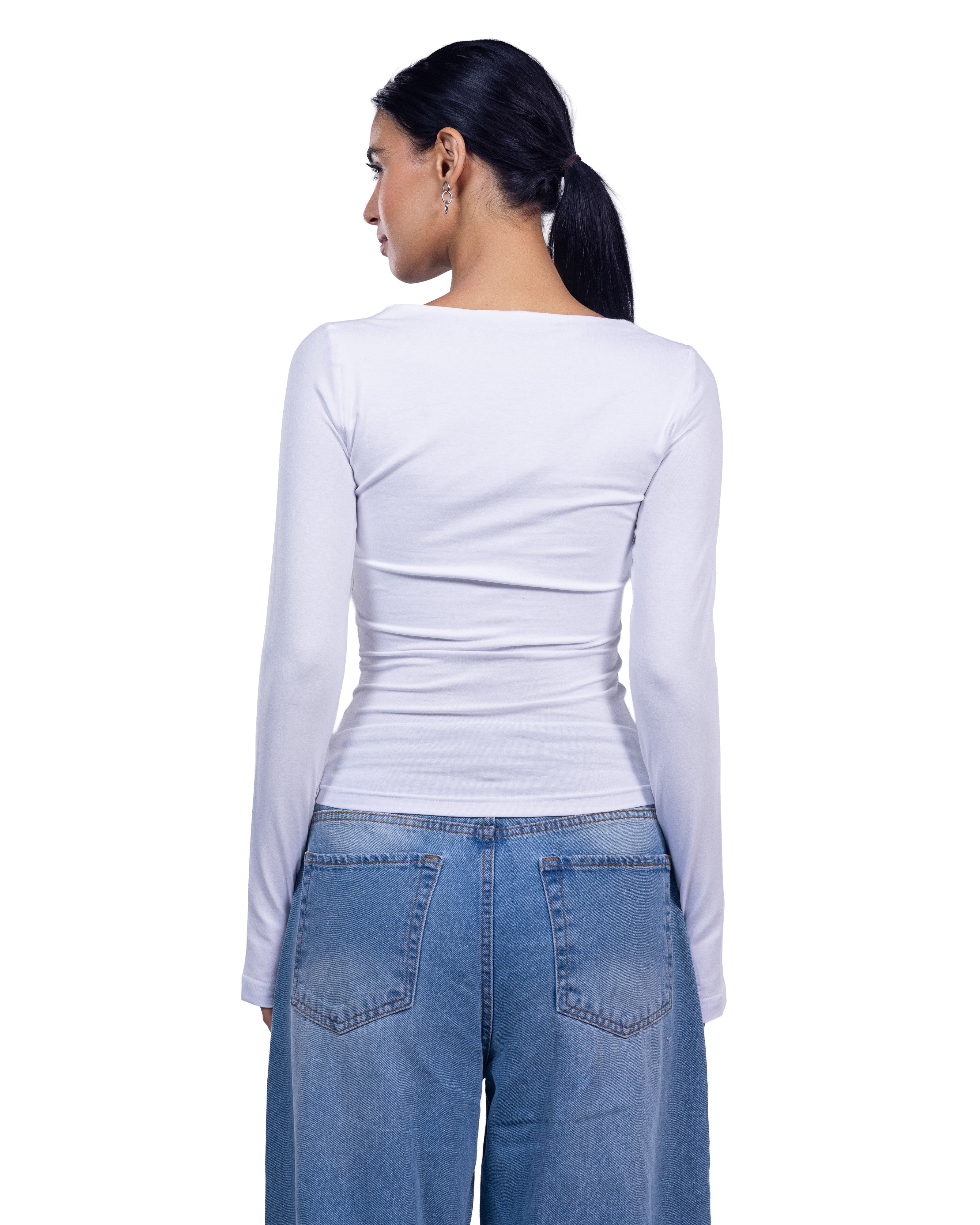 A woman shown from the back wearing a fitted white long-sleeve top and blue jeans against a plain white background.
