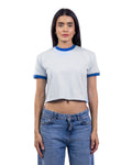 A woman modeling a white cropped ringer t-shirt with blue trim on the collar and sleeve cuffs, paired with blue jeans, against a plain white background.
