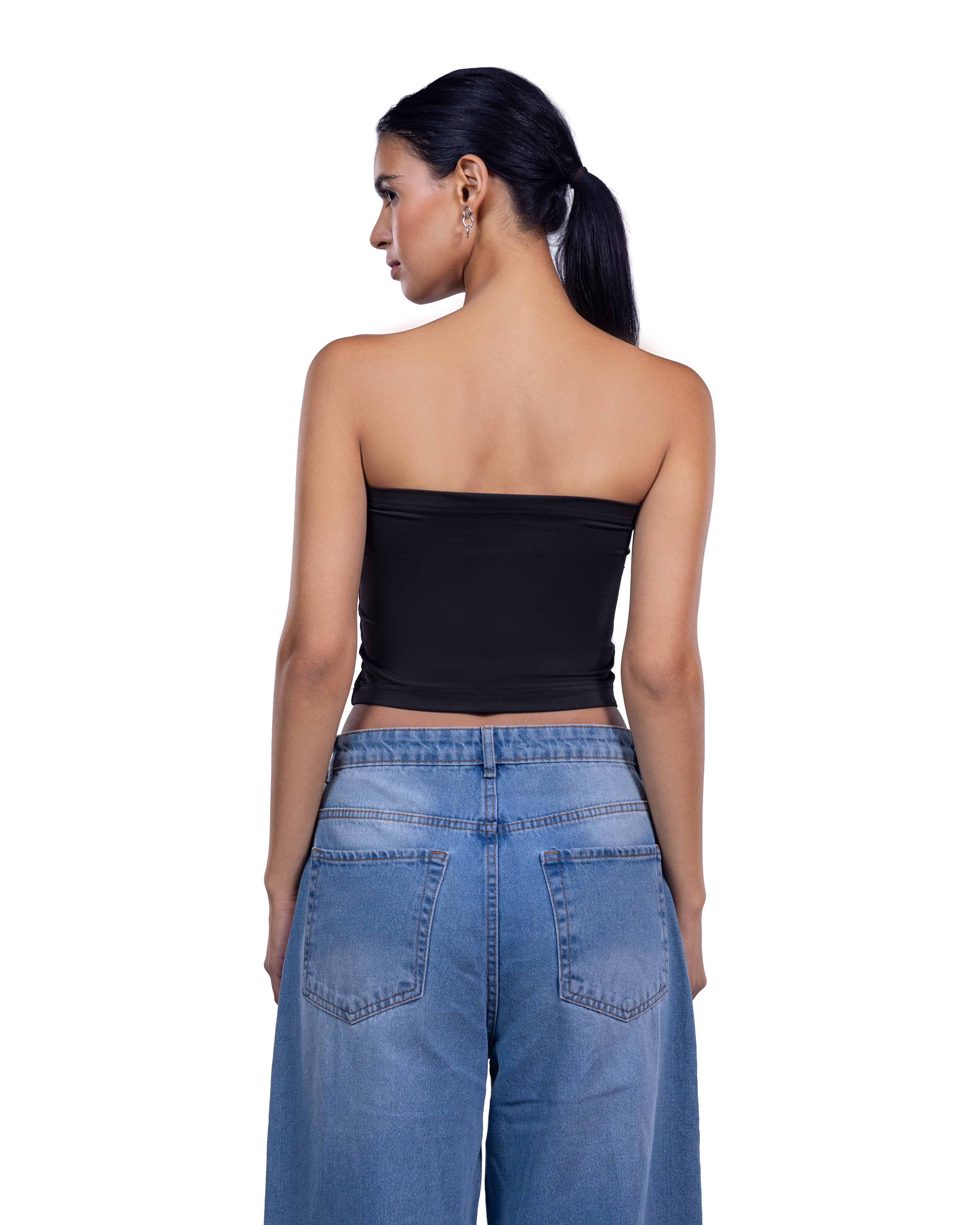A woman shown from the back wearing a black strapless bandeau top and light blue wide-leg denim jeans against a plain white background.