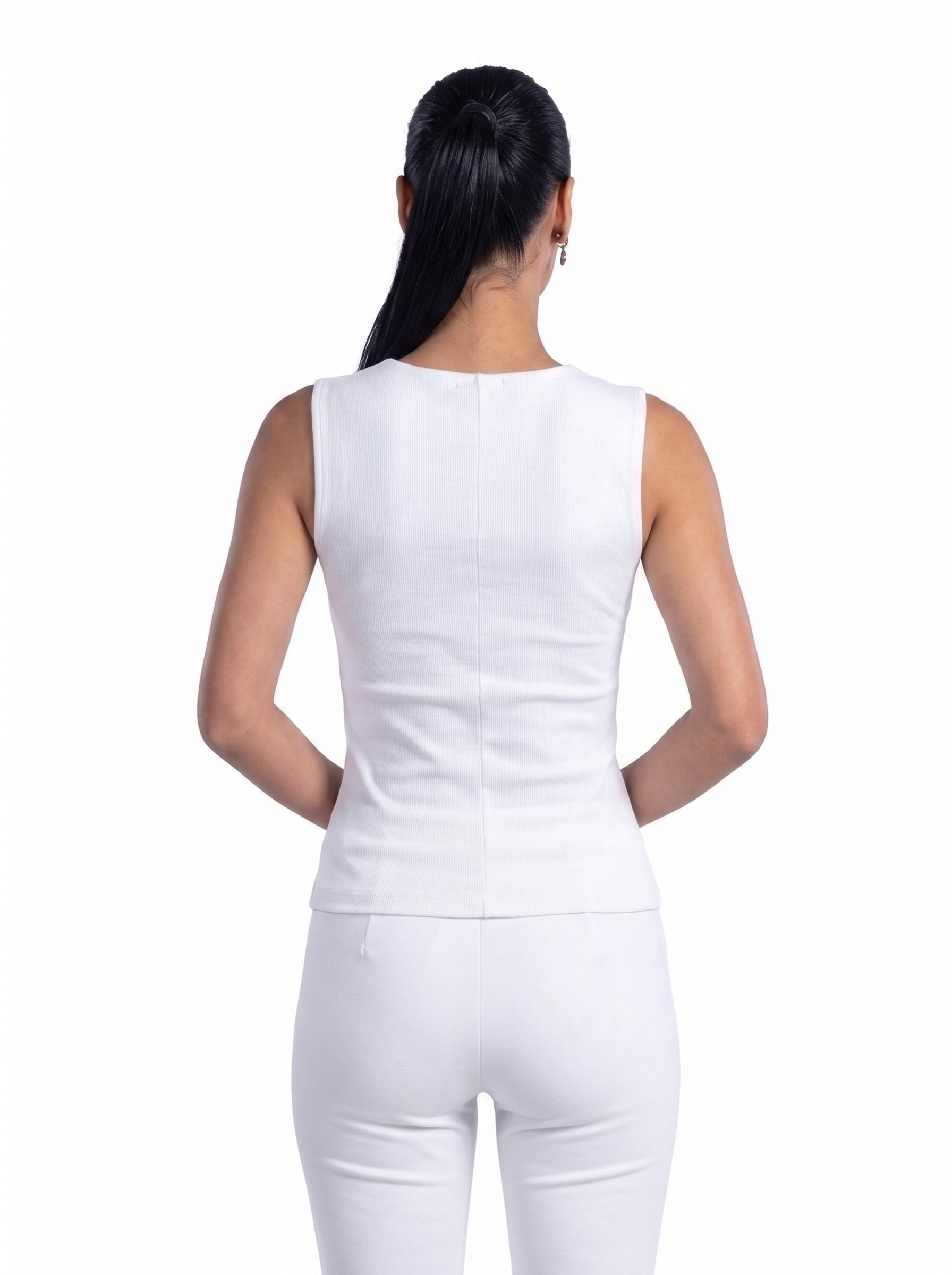 A woman shown from the back wearing a fitted sleeveless white top and white pants against a plain white studio background.