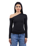 A woman modeling a black long-sleeve asymmetrical one-shoulder top paired with blue jeans, shot against a plain white background.