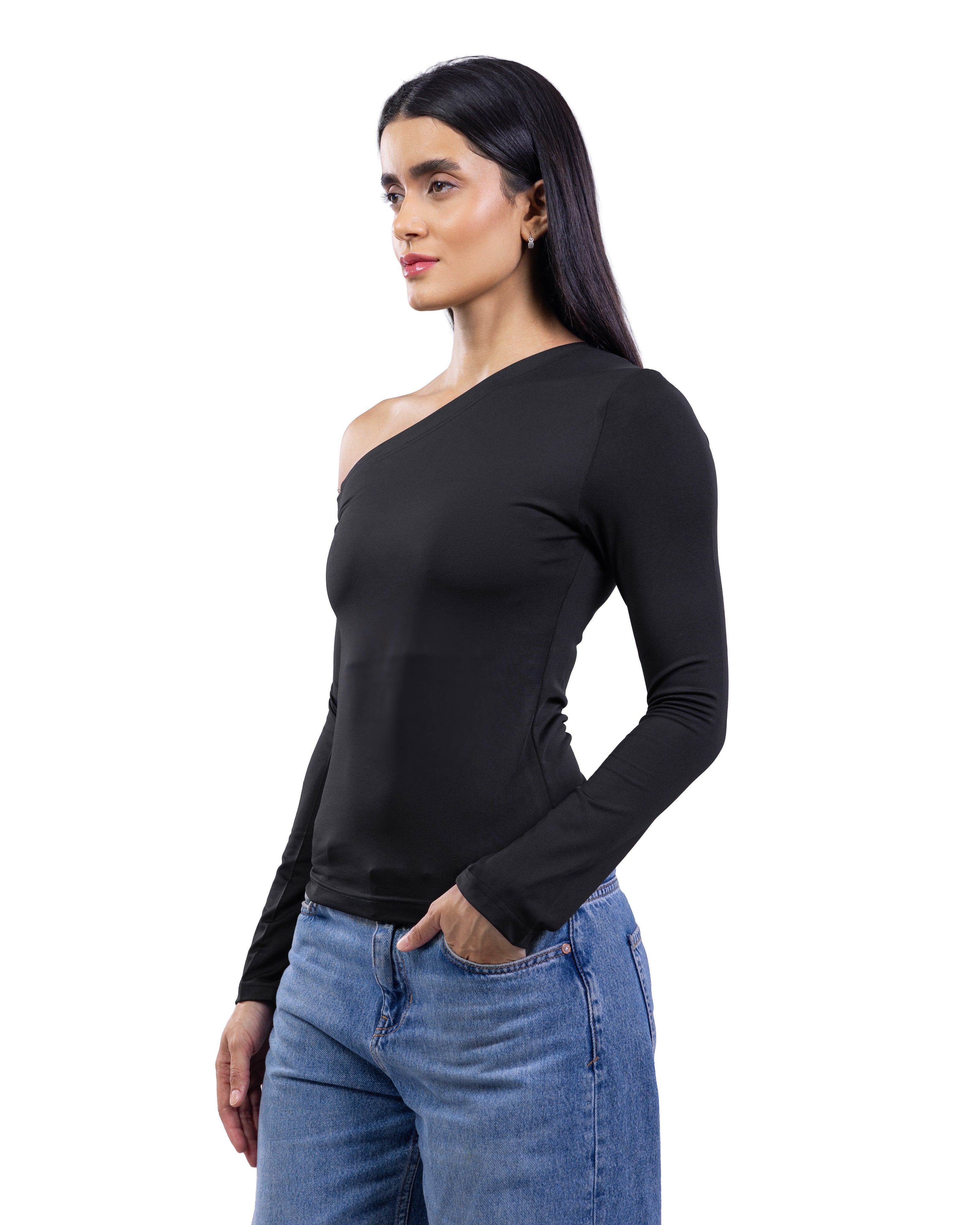 A woman modeling a black long-sleeve one-shoulder top paired with blue jeans against a plain white background.