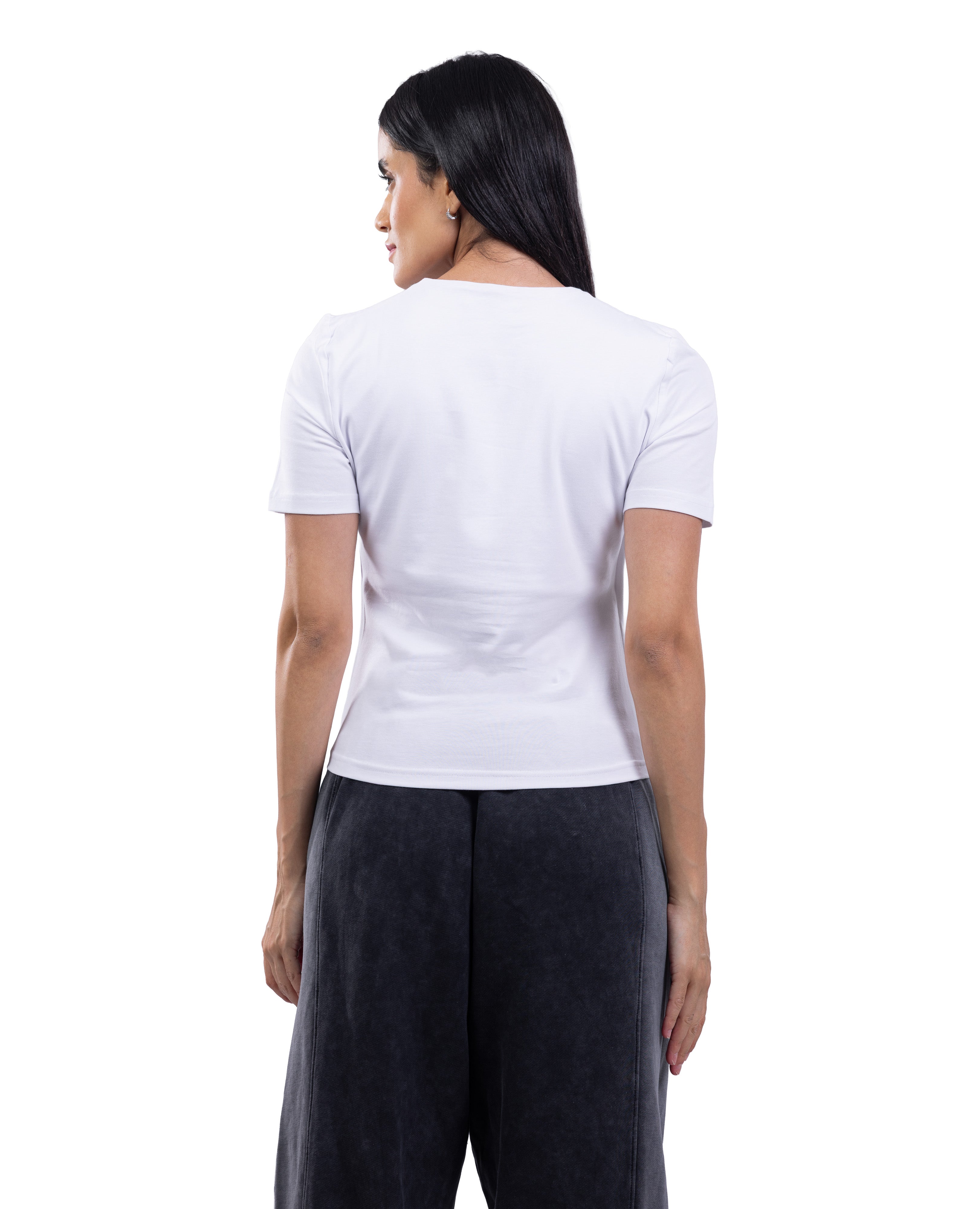 A woman shown from the back wearing a plain white short-sleeve crew-neck t-shirt and dark gray wide-leg pants, photographed against a solid white background.