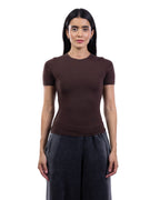 A woman modeling a fitted short-sleeve crewneck top in dark brown, paired with dark gray wide-leg pants, against a plain white background. [model:2]