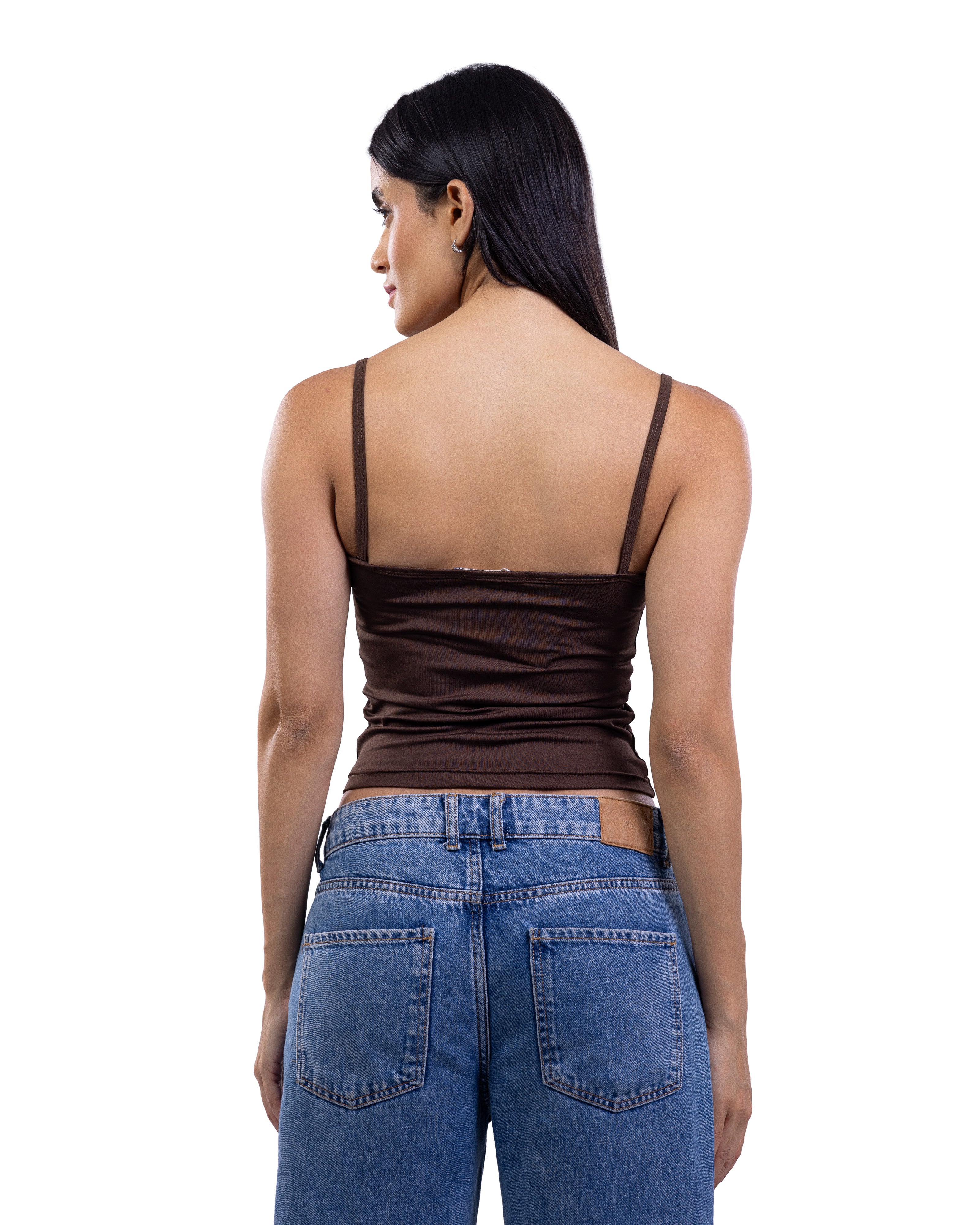 A woman shown from the back wearing a dark brown ruched spaghetti-strap camisole top and blue jeans against a plain white background.