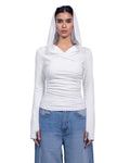 A model wearing a white long-sleeve wrap-style top with a draped hood, paired with light blue jeans, against a plain white background.