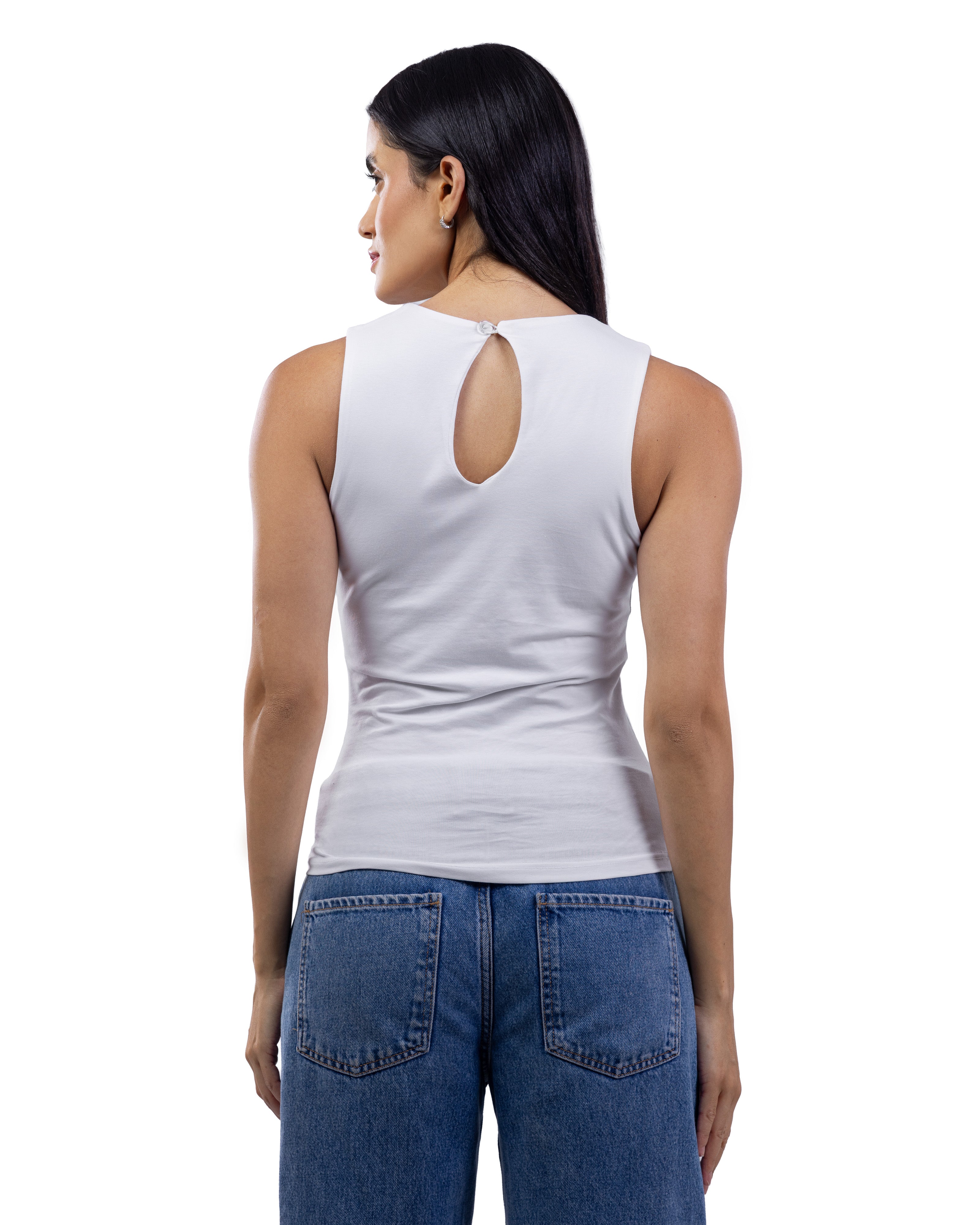 A woman shown from the back wearing a fitted sleeveless white top with a small keyhole cutout at the neckline, paired with blue jeans, against a plain white studio background.