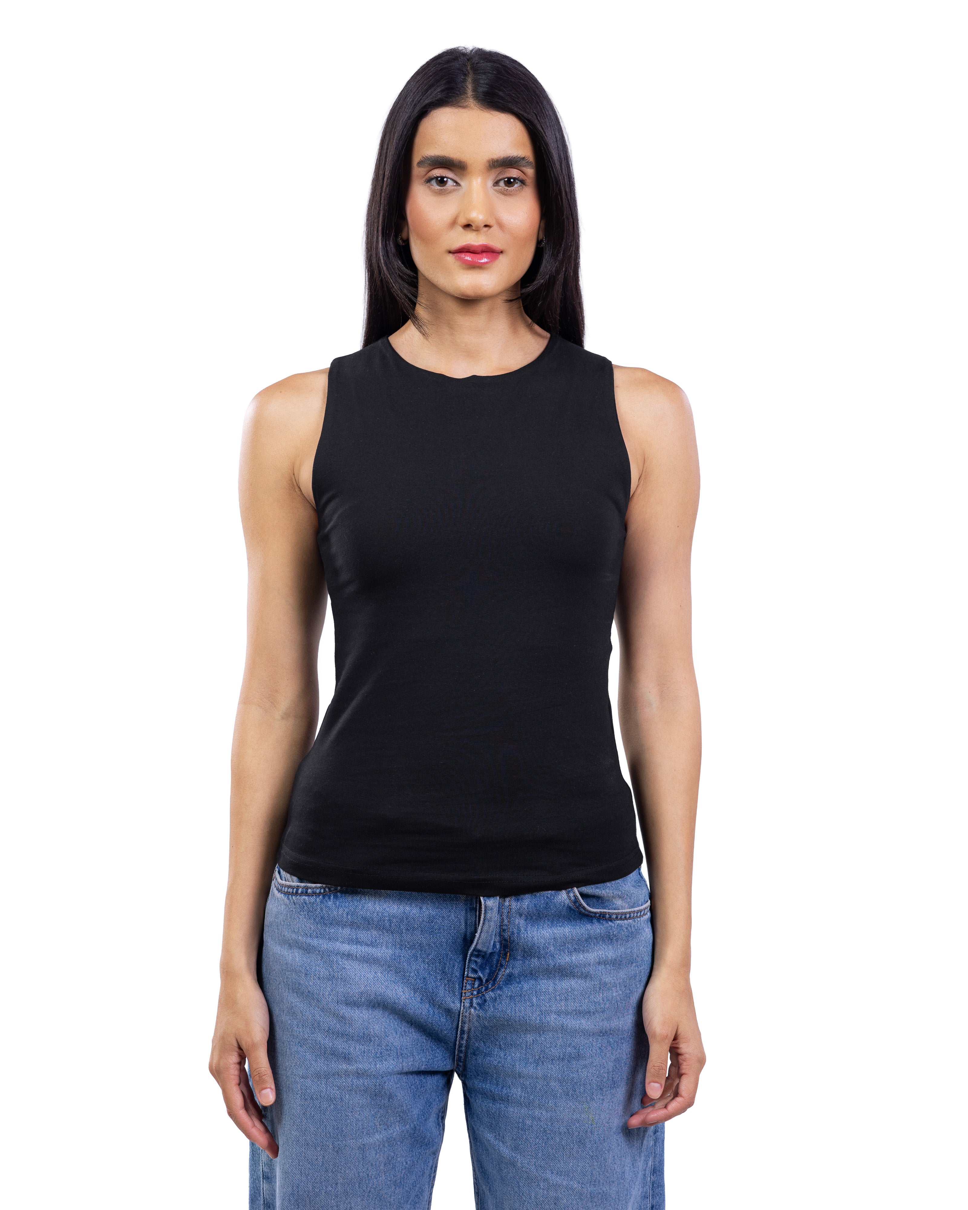 A woman modeling a sleeveless black tank top with a crew neck, paired with blue jeans, against a plain white background.