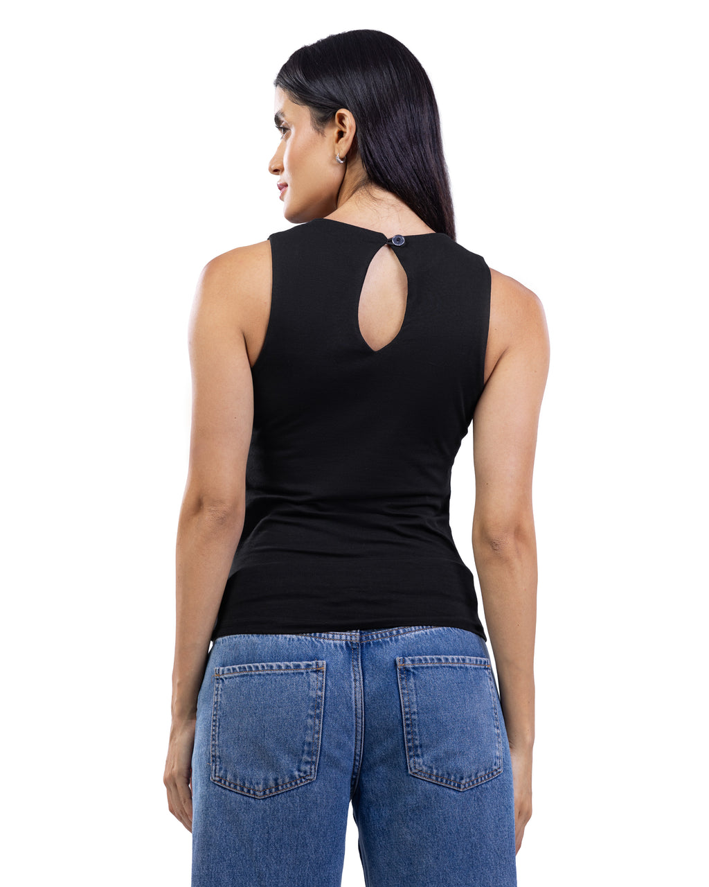 A woman shown from the back wearing a black sleeveless top with a keyhole cutout and blue jeans, photographed against a plain white studio background.