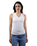 A woman modeling a white sleeveless V-neck tank top paired with blue jeans, photographed against a solid white background.